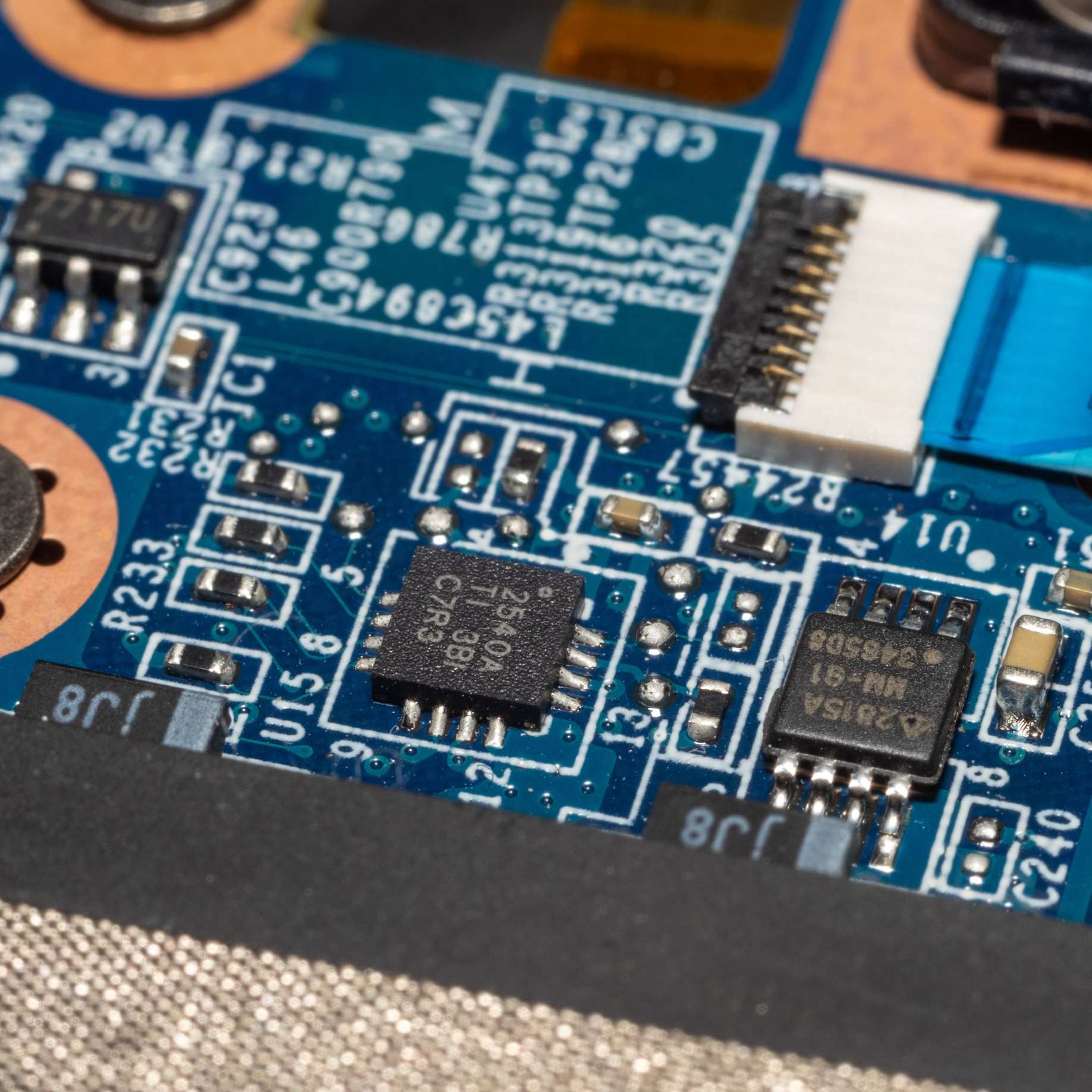 Macro photograph of a circuit board showing microchips and electronic components